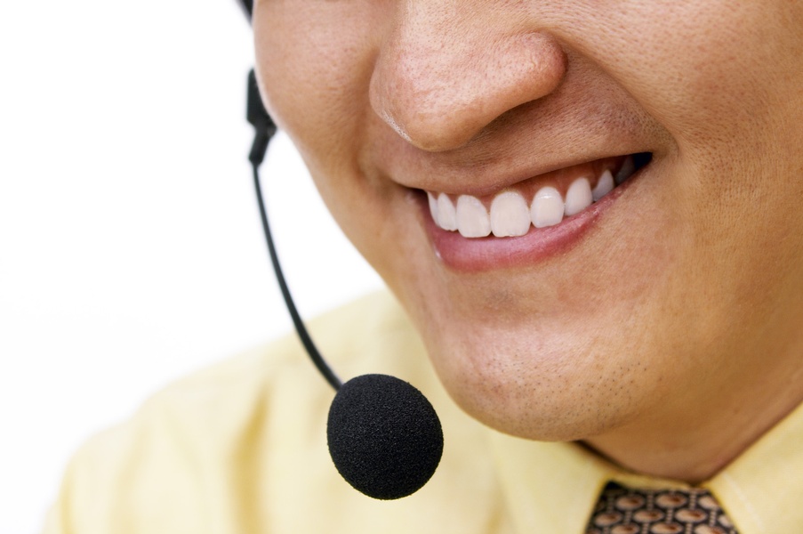 Close up of mans mouth speaking into a headset